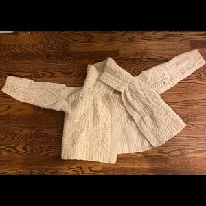 A cream white coloured sweater from Ireland.